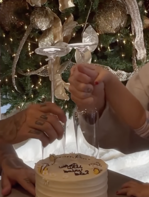 two wine glasses and gender reveal cake